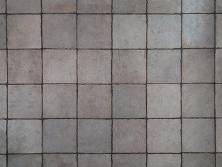 Rustic grey and fawn ceramic tiles for interior or exterior floor, wall, bathroom, porch. Textured gray square glazed slabs texture background with low gloss. Mediterranean style indoor decor.