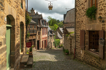 View of the medieval street of the city with half-timbered houses descending to the embankment of...