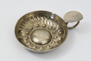 Den Helder, Netherlands. December 15, 2024. A silver plated tastevin, a tool of a sommelier.