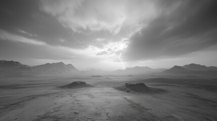 Fototapeta premium Dramatic Black and White Landscape with Lightning Strike Over Mountainous Horizon.