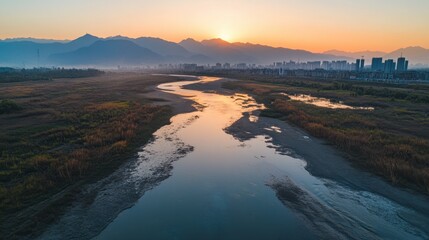 Dawn Over Mountain River and City Skyline, Aerial Scenic View.