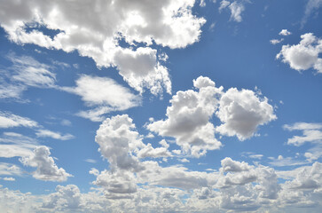 Fluffy white clouds against a blue sky. Australian landscape. Cloudscape. No people.