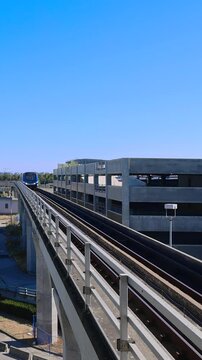 Vancouver train shuttle approaches the terminal at Vancouver International YVR Airport.