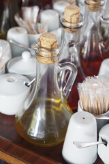 Elegant Table Condiments Arrangement with Oils and Sweeteners