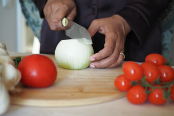 Chopping Fresh and Colorful Vegetables in a Modern, WellEquipped Kitchen