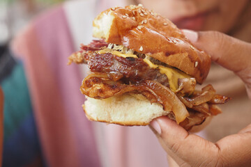 Delicious Gourmet Burger with Melted Cheese and Caramelized Onions