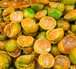 Orange peel is in the waste bin a the market fruit of Thailand 