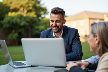 Business Team Collaborating Outdoors with Laptops on a Bright Sunny Day, Fostering Creativity and Engagement in a Professional Environment