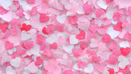 Valentine's Day, A vibrant and heartfelt assortment of pink and white heart-shaped confetti scattered across a surface