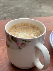 Peanuts in a cup of perfect Masala Chai.