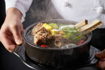 Galbitang in the hands of a chef, traditional Korean food
