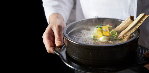 Galbitang in the hands of a chef, traditional Korean food