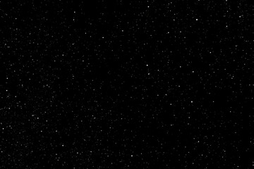 A vast expanse of space filled with countless stars against a black background, creating a sense of depth and infinity.