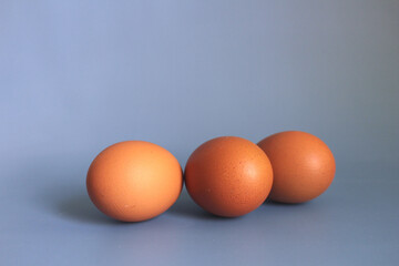 Easter basket full of eggs ,on blue background and isolated on white background.