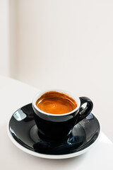 Espresso pouring from coffee machine at cafe,Brewing the espresso coffee from the machine warm tone