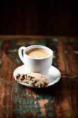Cup of coffee and Cantuccini (Italian cookie) on dark wooden background. Copy space.	