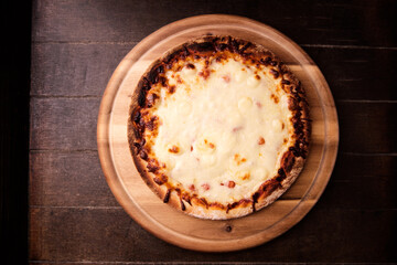 Pizza margherita on wooden background. Soft focus. Top view. Close up.	