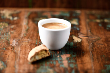 Cup of coffee and Cantuccini (Italian cookies) on dark wooden background. Copy space.	