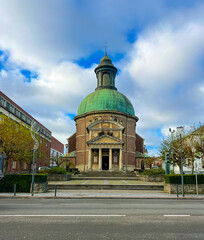 Naklejka premium Neoclassical Church with Green Roof, Grand Dome and Ornate Classical Facade