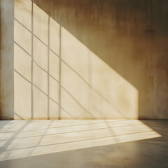 Sunlight streams through window creates shadows on wall and floor in empty room with beige wall and concrete floor