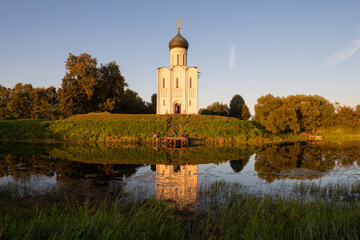 View of the medieval Church of the Intercession of the Holy Virgin on the Nerl on a warm September evening. Vladimir Region, Russia