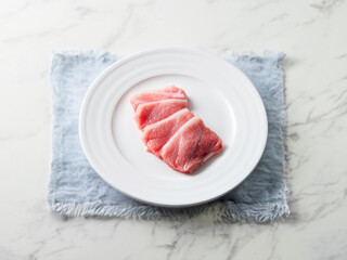 Fresh sliced raw tuna on plate