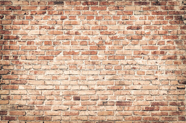 Grunge pale red brick wall texture