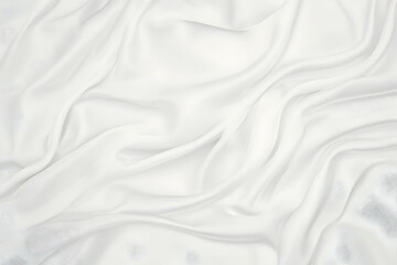 Naklejka premium Smooth, elegant white fabric drapes gracefully, creating soft folds and a luxurious texture.