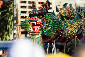 Chinese dragon dance show on street in the Chinese New Year festival.Chinese dragon costume used...