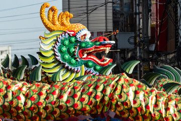Chinese dragon dance show on street in the Chinese New Year festival.Chinese dragon costume used...