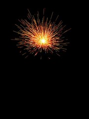Fototapeta premium An explosive burst of fiery sparks against a dark background, fireworks, abstract, intense