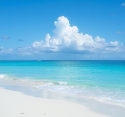 Fototapeta premium White sand beach and turquoise water under blue sky with clouds