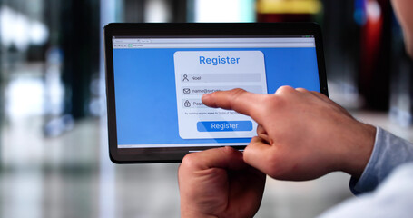 Businessman's Hand Filing Online Registration Form