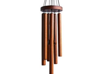 Wind chimes made of wood hanging gracefully in a tranquil outdoor setting
