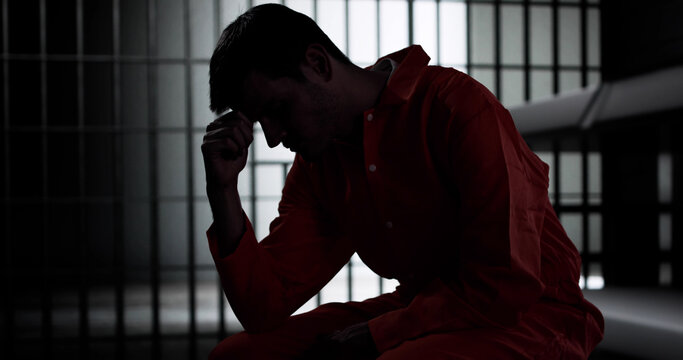 Prisoner Behind Bars In Jail Cell. Crime Punishment