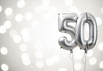 Silver helium floating balloons made in shape of number fifty. Birthday jubilee party or wedding anniversary for 50 years celebration on white background. 