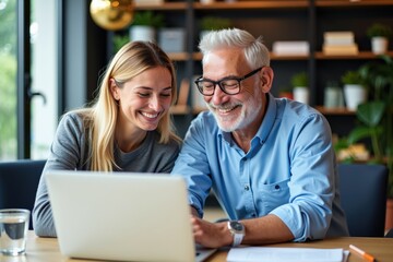 Smiling Young Woman and Elderly Man Collaborating Over Laptop in Cozy Office Setting with Bookshelves and Indoor Plants - Intergenerational Technology Connection