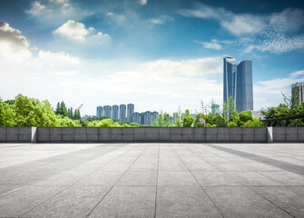 Expansive Urban Landscape with Modern High-Rise Buildings and Lush Greenery