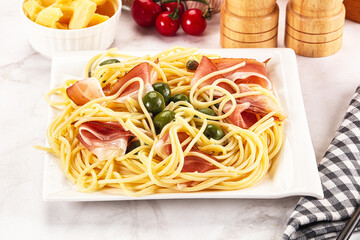 Pasta spaghetti with olives and jamon