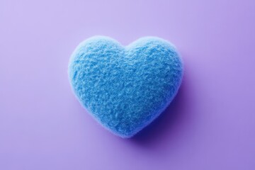 Obraz premium A vibrant blue 3D fluffy heart icon with a felt material finish, placed on a solid lavender background. The natural lighting emphasizes the clear, simple details.