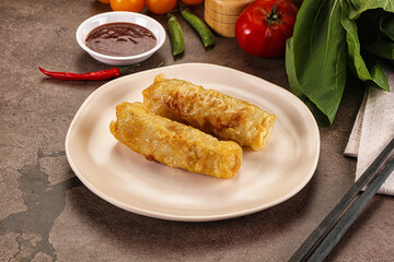 Vietnamese stuffed spring roll served sauce