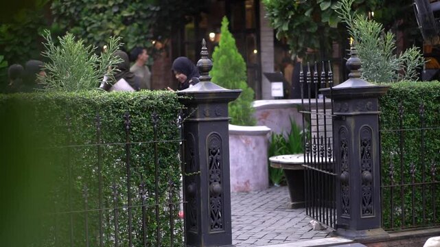 The restaurant is decorated with fountains, trees and sculptures.