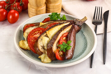 Baked tomato with mozzarella and tomato