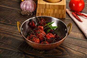 Baked cheeryy momatoes with olive oil