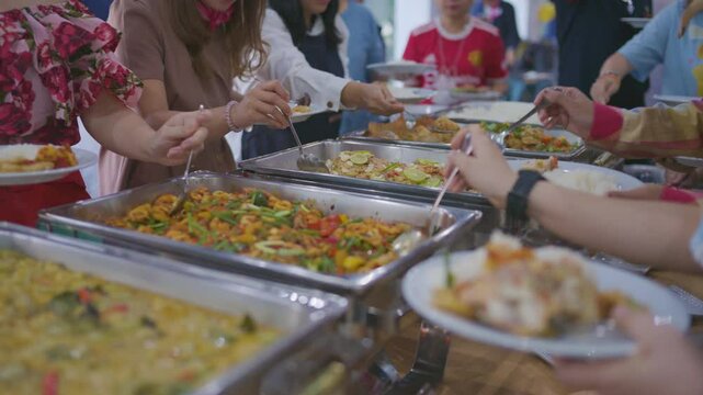 People hand grab various buffet food seminar hotel room food and drink background