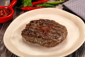 Grilled beef burger cutlet with sauce