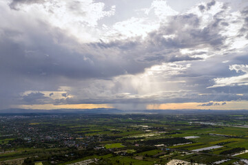 Aerial view Arcus cloud or shelf cloud: rainstorms, and black clouds moving over the mountains in northern Thailand's Mae Mo district, Lampang.