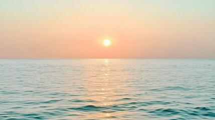 Obraz premium serene ocean view with soft gradient of pale aqua merging into light peach hues, as sun sets on horizon, casting warm glow over calm water