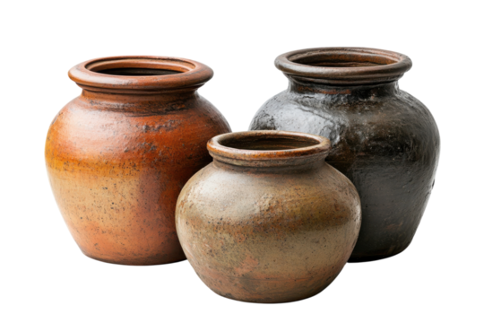 Traditional clay pottery displayed in a rustic setting showcasing craftsmanship and artistic design