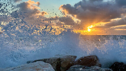 Powerful waves crashing onto the rocks at Malaga beach